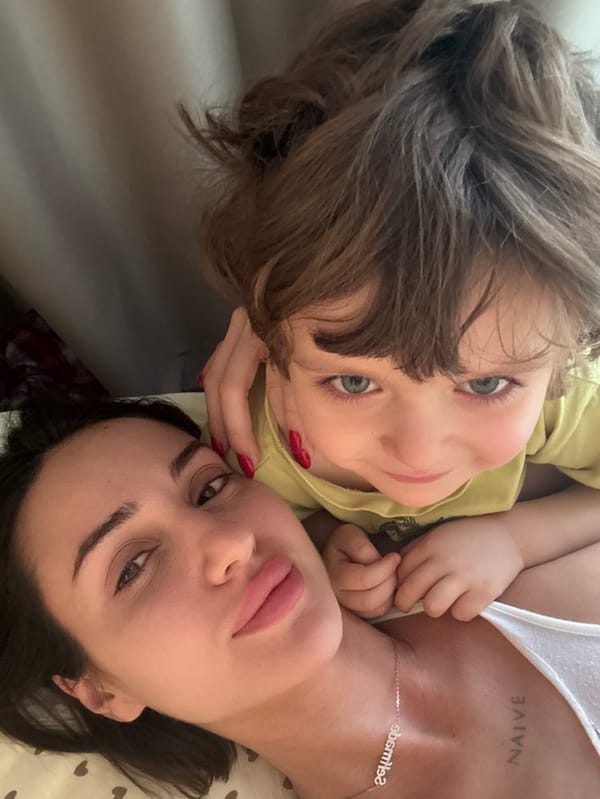 Woman and child photographed in home interior setting