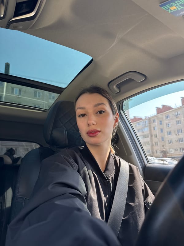 Woman takes selfies in car, multiple angles captured