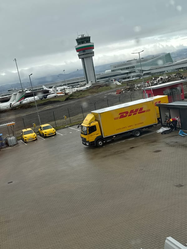 Normal airport operations observed at Sofia with planes, delivery truck