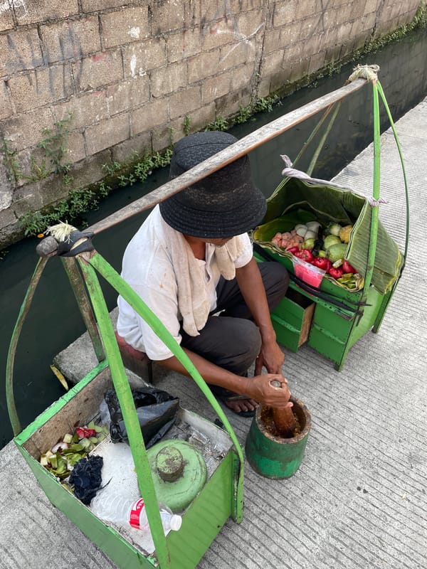 Street food vendor operates in North Jakarta morning scene