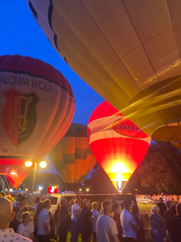Hot air balloons glow at dusk festival in Tychy, Poland