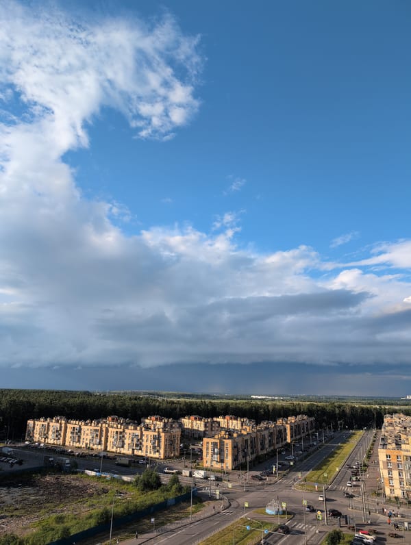 Storm, rainbows, and sunset over Saint Petersburg's residential skyline