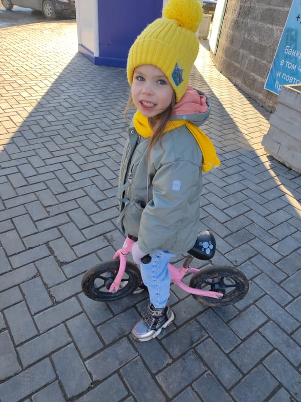 Girl rides pink bike through Votkinsk streets