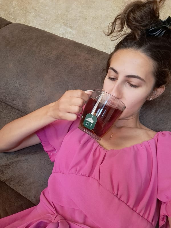 Woman enjoys morning tea and fresh strawberries in Bulgarian village