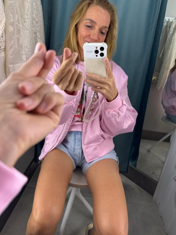 Woman Takes Selfies While Trying On Clothes in Russian Store