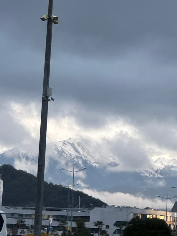 Cloudy afternoon view captures Sochi mountains and urban landscape