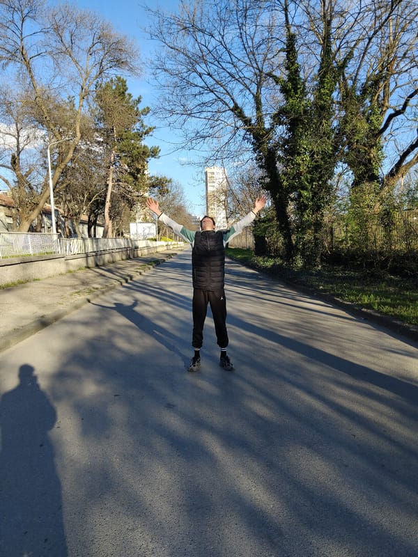 Man stands with outstretched arms on Kazanlak road