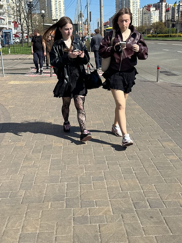 Everyday street scenes captured across central Kyiv neighborhoods