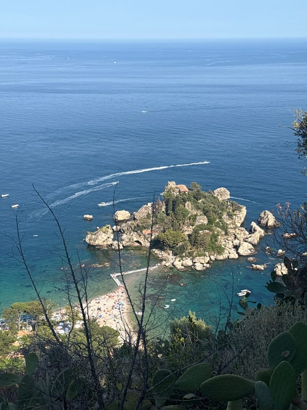 Tourist documents wildlife and coastal views in Taormina, Sicily