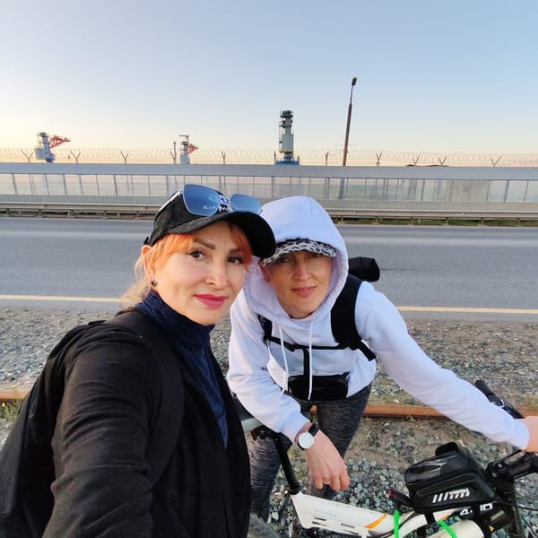 Two women document sunset cycling trip in Chaikovsky, Russia