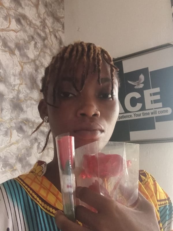 Woman poses with flowers, beauty products in Shagamu home