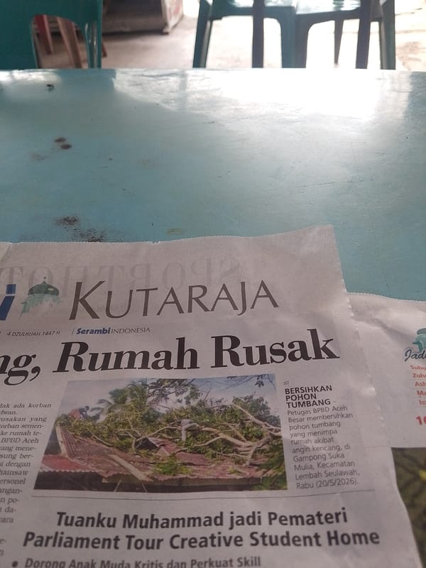 Newspaper reporting damaged houses documented in Lhokseumawe outdoor area