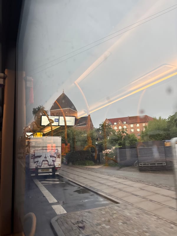 Rainy Copenhagen morning seen through a moving tram window