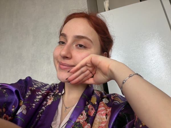 Woman photographed in quiet indoor moments in Tbilisi