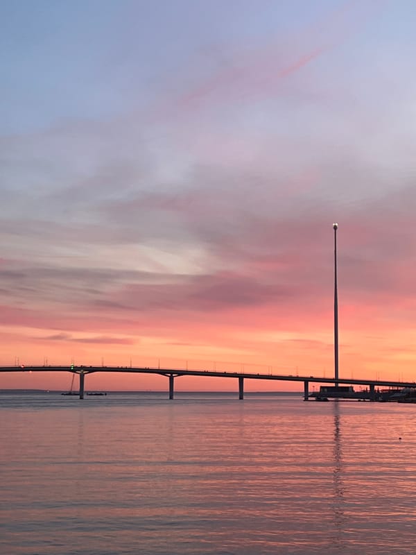 Sunset captured over Saint Petersburg waterfront bridge April 21