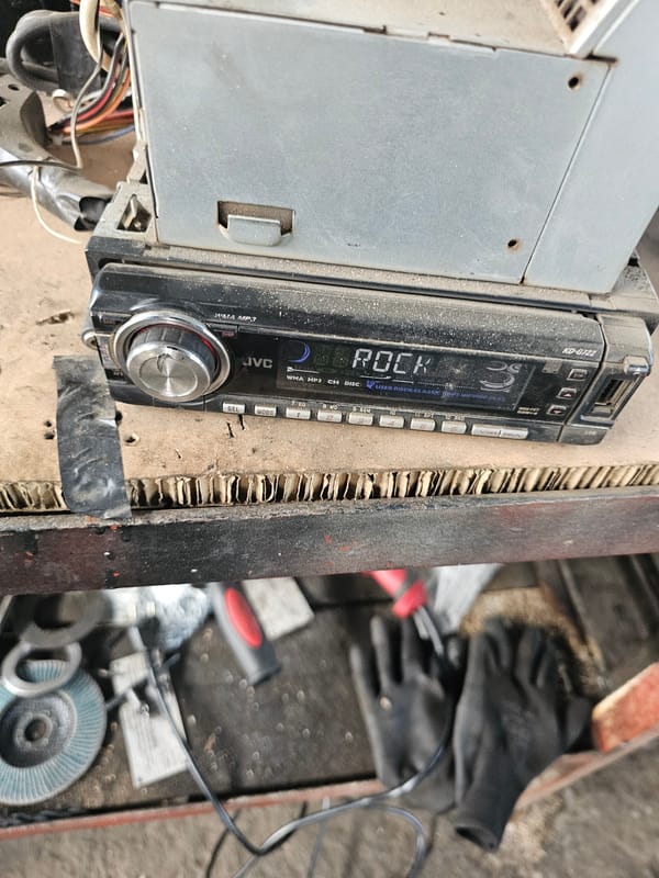Car radio rigged in makeshift frame at Bulgarian workshop
