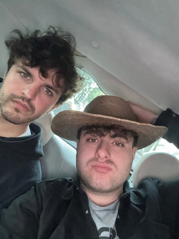 Two men spotted in car, one wearing straw hat