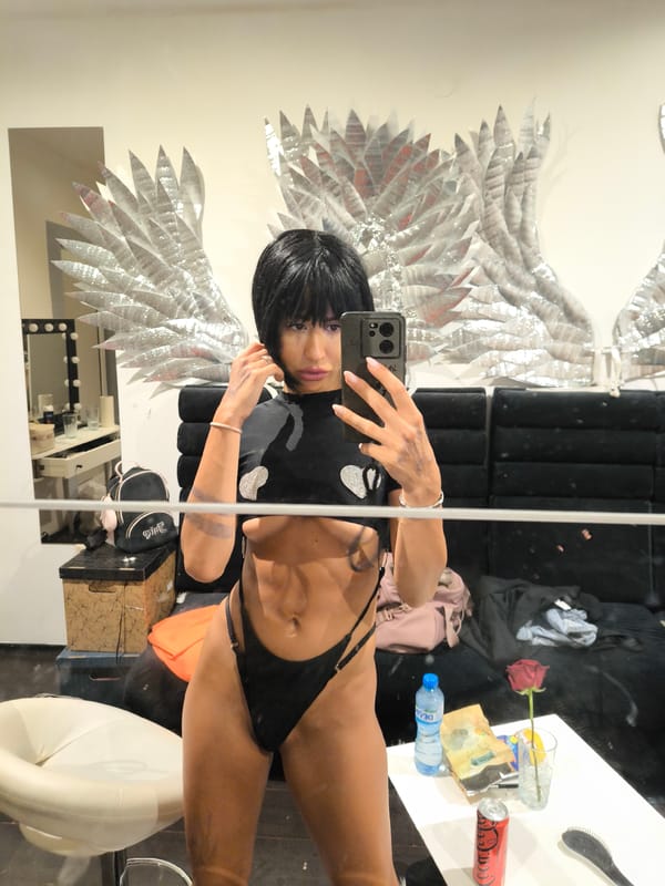 Backstage mirror selfies in Sofia with silver wings decor