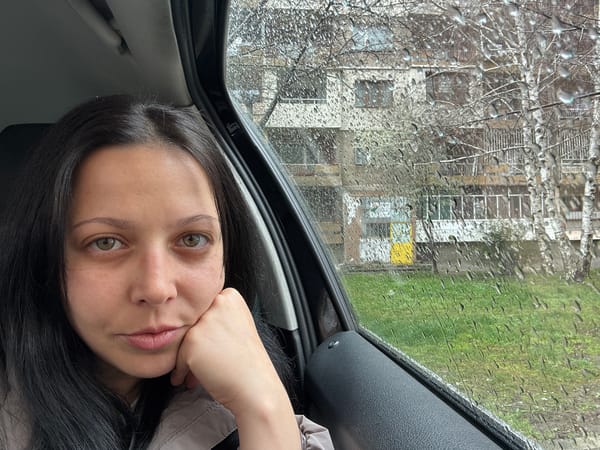 Woman in car during rainy day in Pernik, Bulgaria