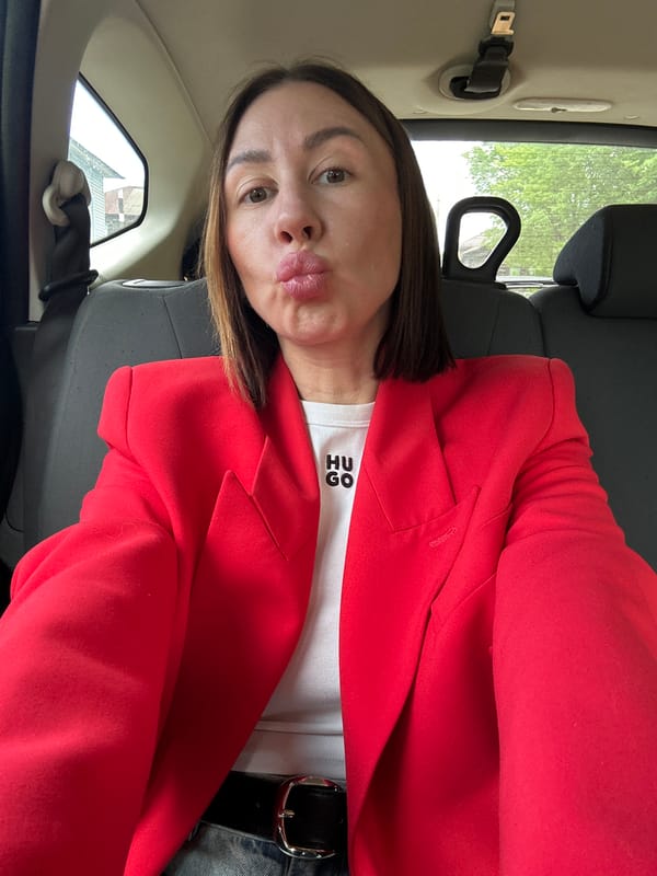 Woman in red blazer observed in vehicle, Votkinsk