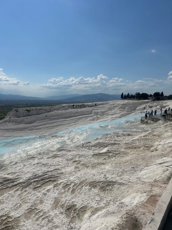 Tourists document Pamukkale's iconic white terraces and thermal pools