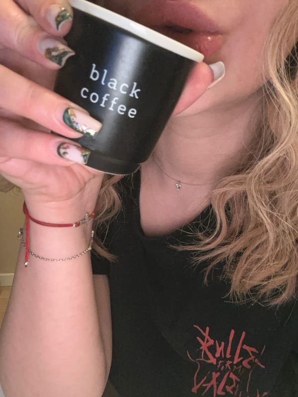 Woman with coffee and band merchandise spotted in Plovdiv