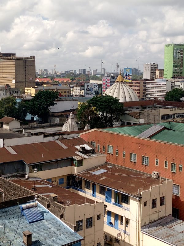 Elevated views document Nairobi's dense urban landscape Saturday morning