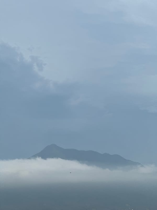 Mountain peaks and overcast skies on a cloudy afternoon