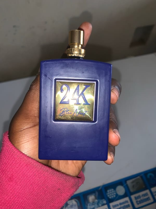 Nigerian vendor documents perfumes, money, street scenes in morning session