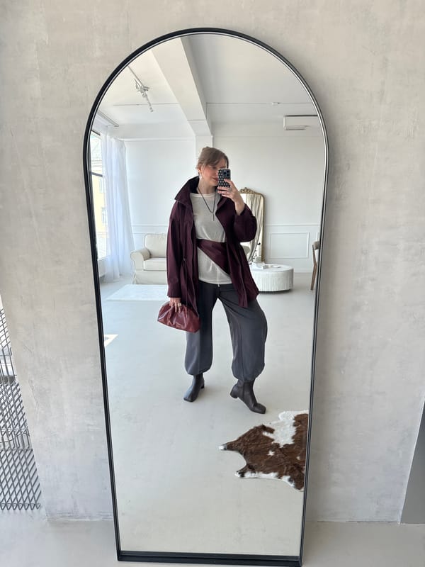 Woman takes mirror selfie indoors in Izhevsk, Russia