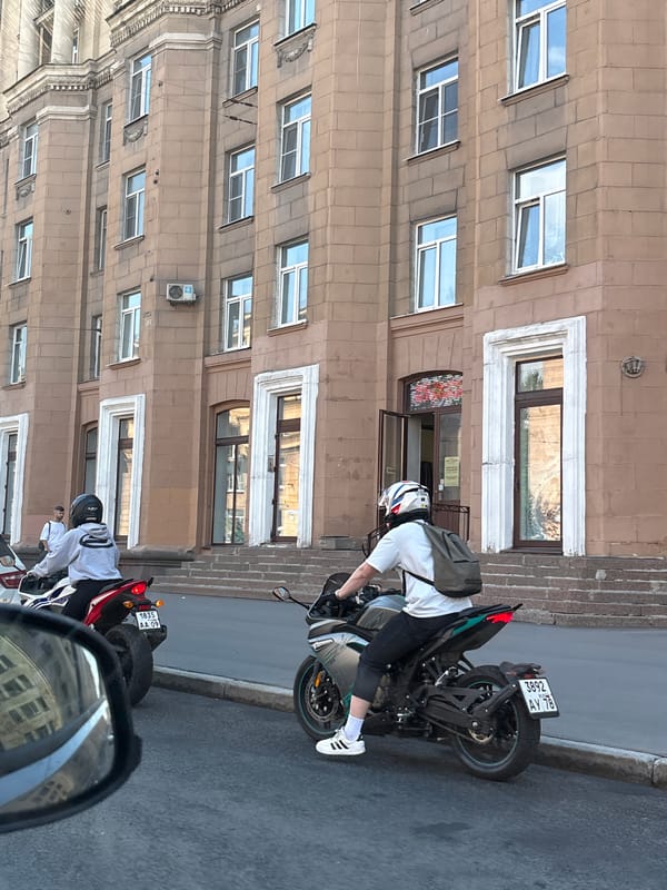Motorcyclist observed on Saint Petersburg street during midday traffic