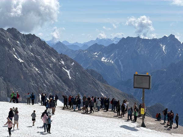Tourists visit snow-covered Zugspitze peak in Bavarian Alps