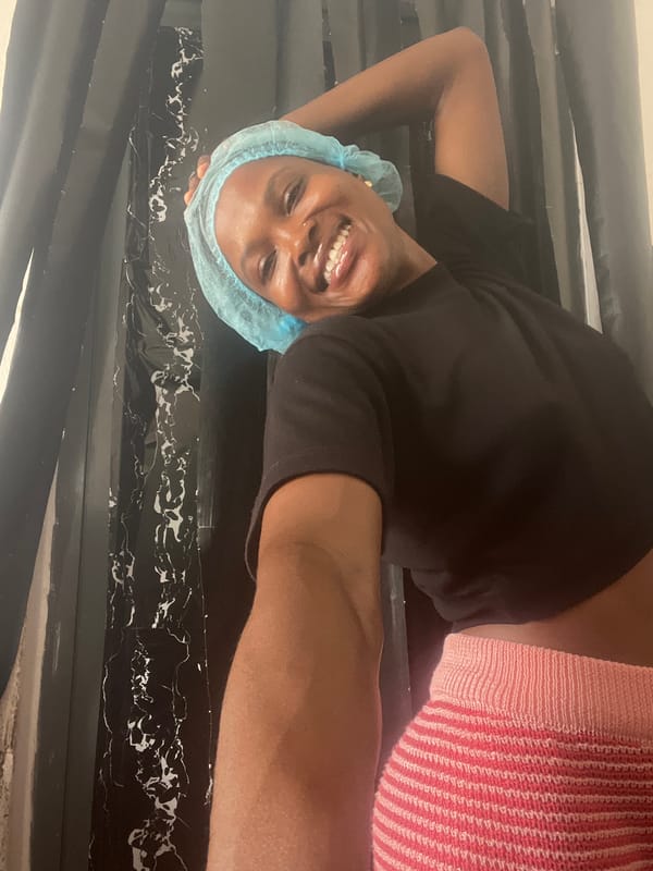 Woman in surgical cap poses playfully during Lekki photoshoot