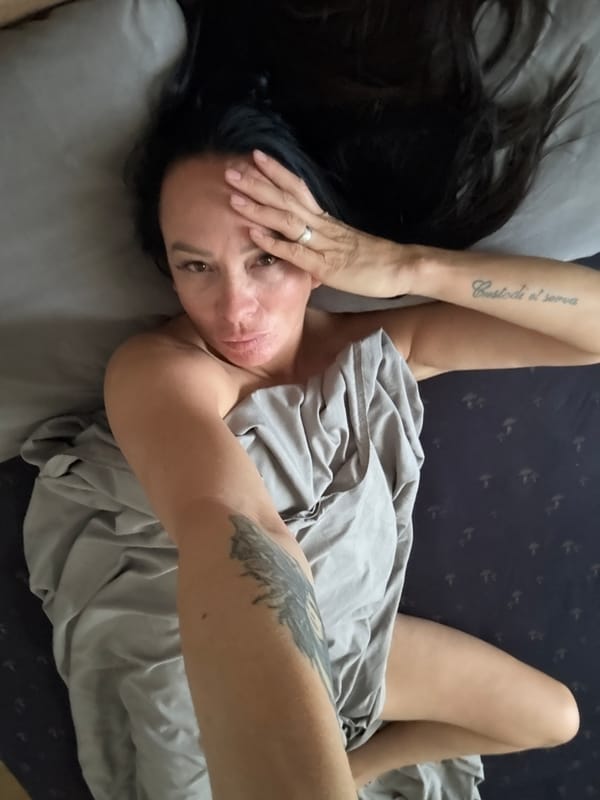 Relaxed at-home moments on a patterned bed in Chaikovsky