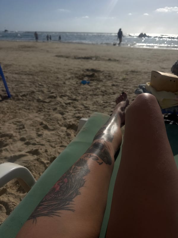 Beachgoers relax and play at Bat Yam on sunny afternoon