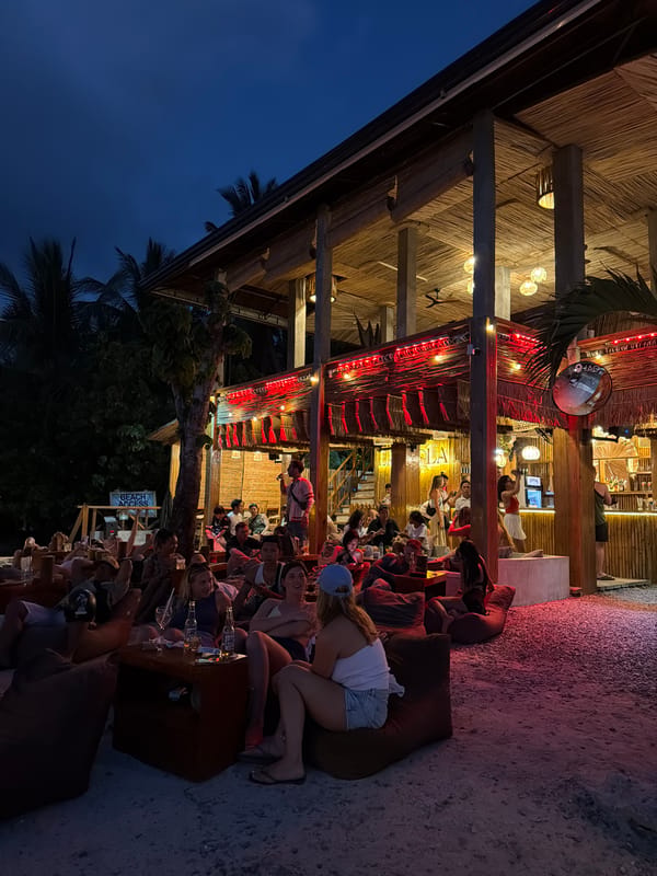 Evening beachfront dining scene documented in General Luna, Philippines
