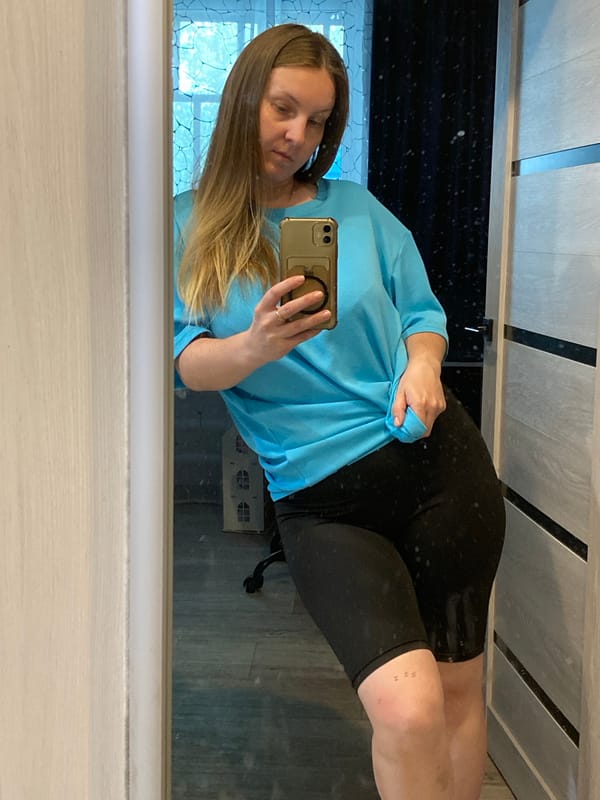 Woman takes selfies at home in Noviy, Russia