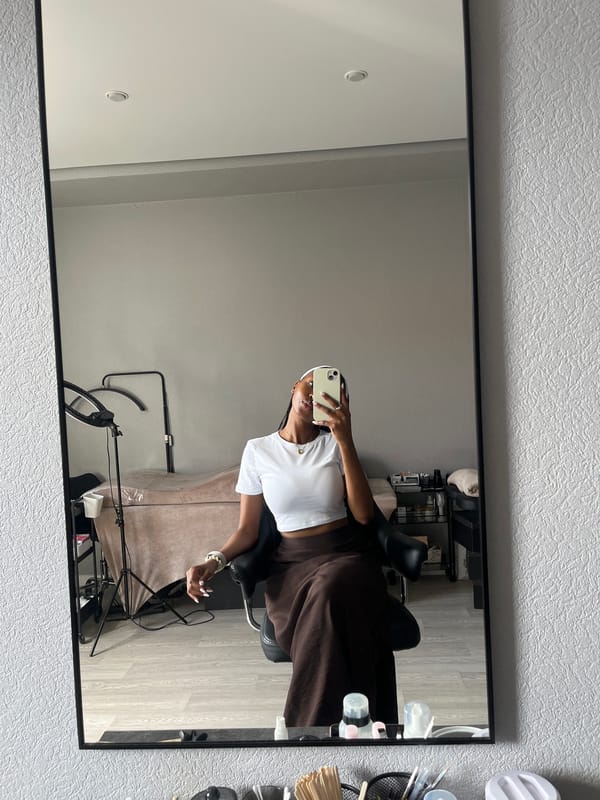 Woman takes mirror selfie in Kazan studio setting
