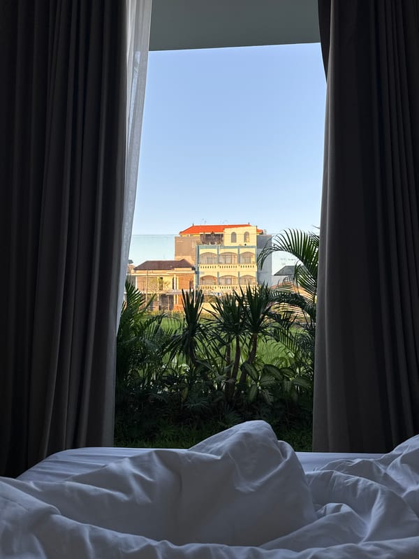 Evening window view captures colorful buildings in North Kuta