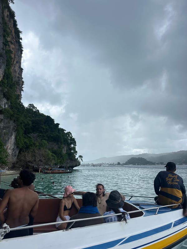 Boat tour through Ao Nang's cloudy karst island waters