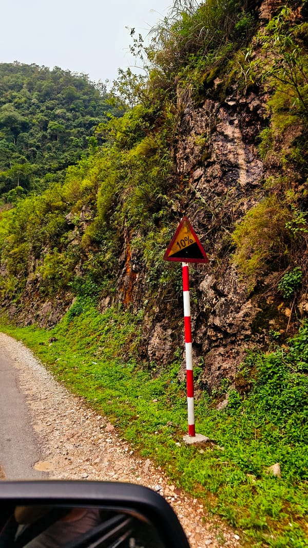 Regular traffic flows through Cán Tỷ Commune road Vietnam