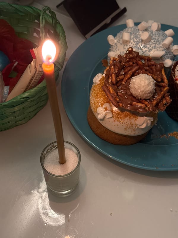 Evening candlelit gathering with cupcakes and treats documented