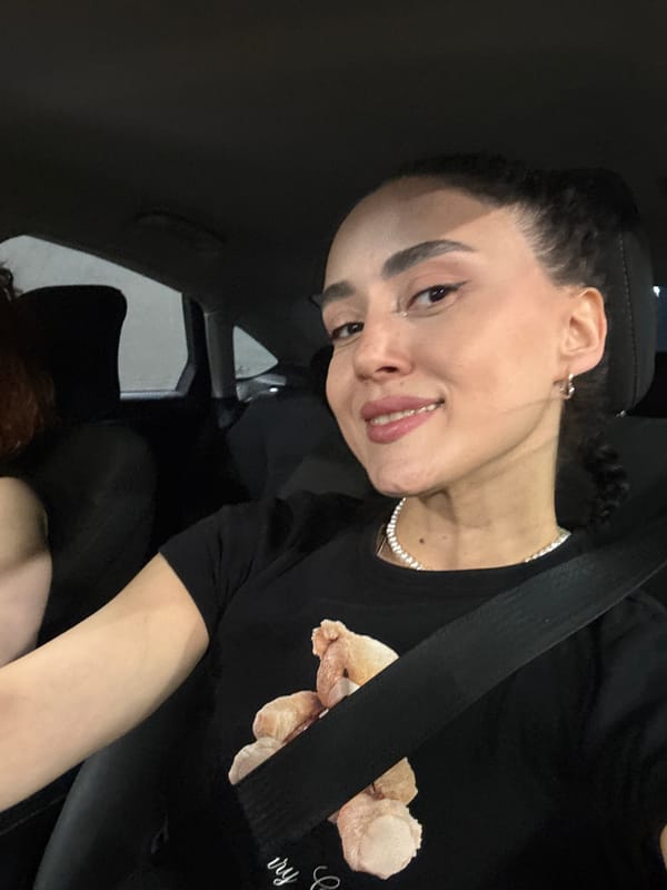 Two women photographed in car in Tbilisi