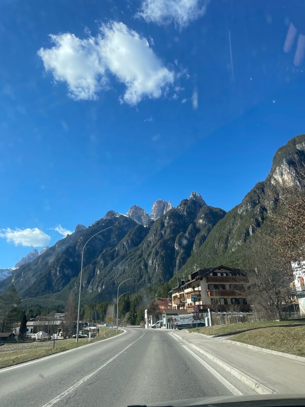 Woman travels scenic mountain road in Auronzo di Cadore