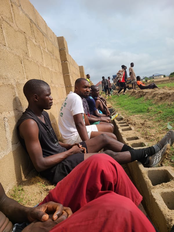 Athletes gather and rest at outdoor sports facility