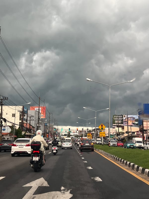 Storm clouds gather over busy Ko Kaeo street