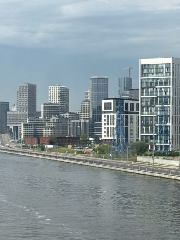 Moscow River waterfront with active boat traffic and city skyline