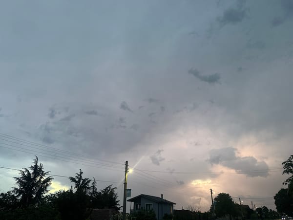 Evening storm clouds gather over wet streets in Byala