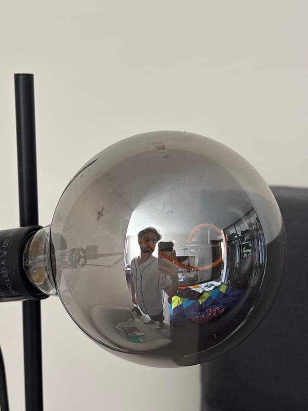 Light bulb reflection captures photographer in Santa Clara Ocoyucan