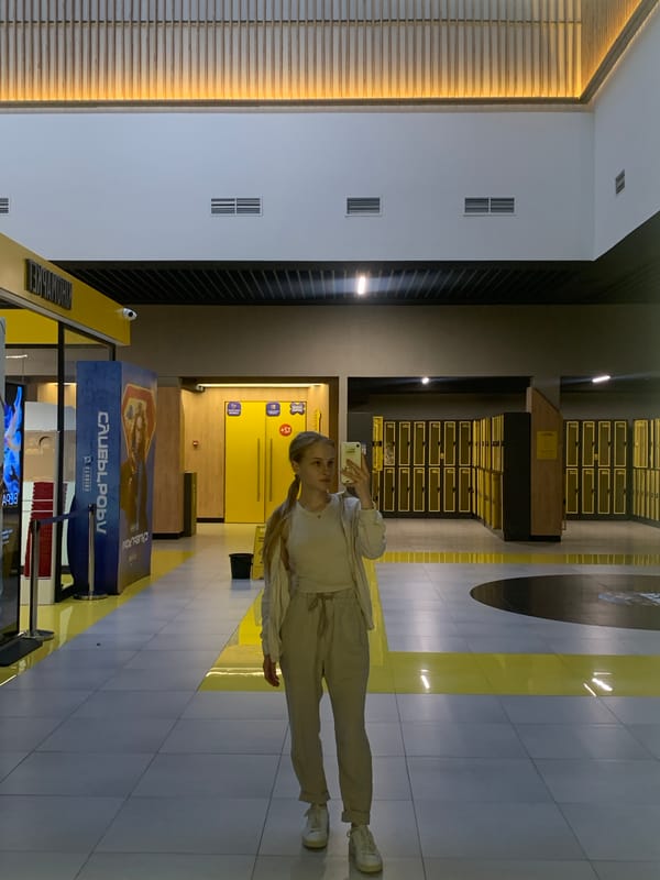 Woman takes selfies in modern Kyiv public facility